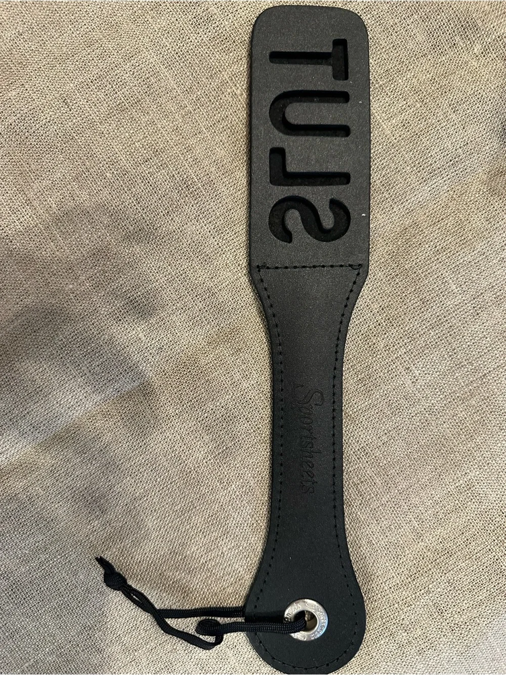 Black Leather Paddle with Embossed Lettering and Wrist Loop